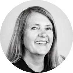 Karen Le Marquand. Karen is a white woman with long red-blonde hair. She is wearing a dark top.