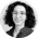 Margot Fourcade. Margot is a young woman with dark curly hair and glasses. She is wearing a necklace and a dark shirt.