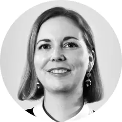 Claire Porteous. Claire is a young white woman with a chin-length dark blonde bob. She is wearing dangly earrings and a white collared top.
